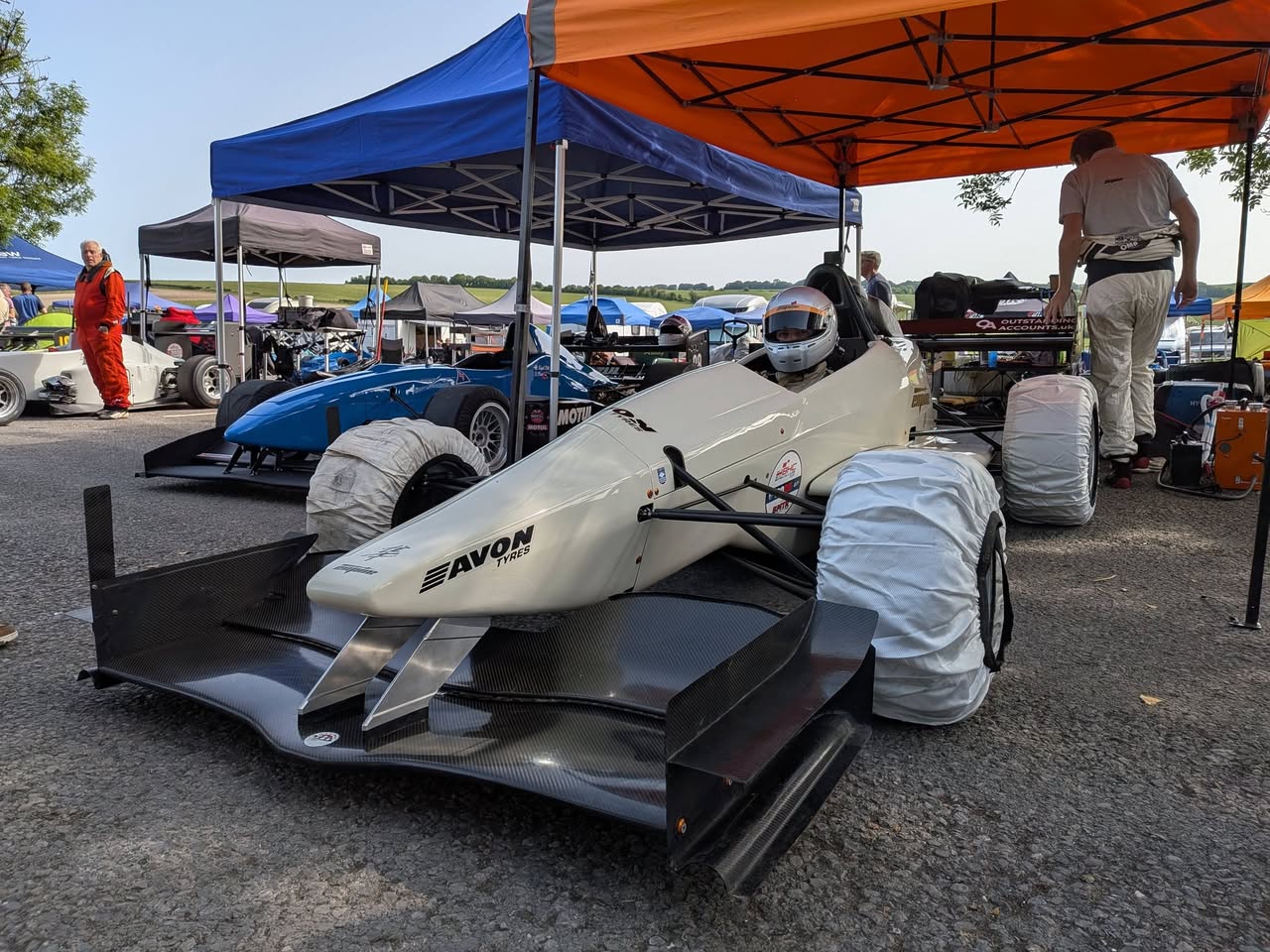 White Empire Evo 3 hillclimb car in the paddock