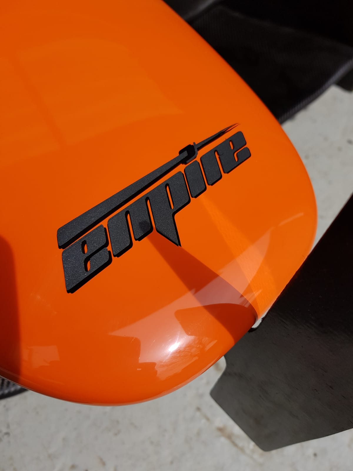 Orange nose and carbon bodywork of an Empire Wraith